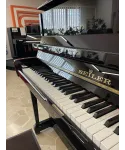 Glossy black vertical piano
