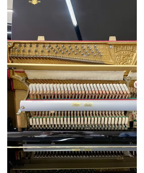 Glossy black vertical piano