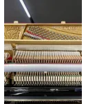 Glossy black vertical piano