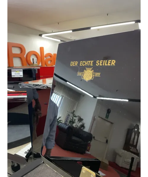 Glossy black vertical piano